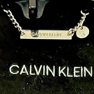 Calvin Klein black long trench coats.